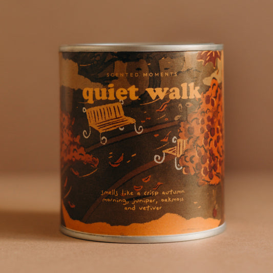 quiet walk autumn candle by otio in a cozy forest-inspired setting with juniper and spruce notes.